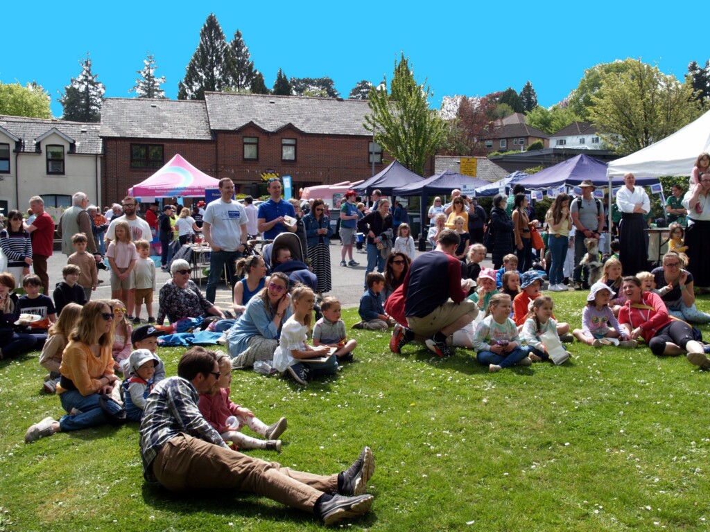 Crowd sitting on grass at the 2022 Fete